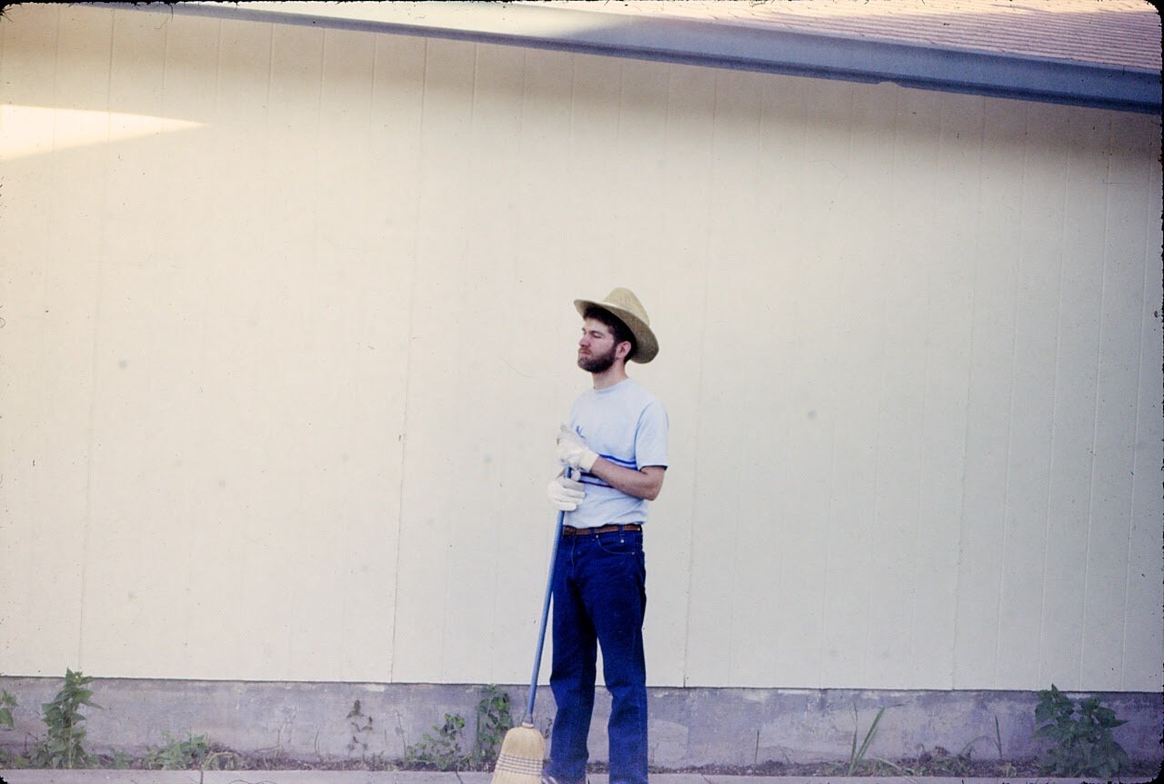 A younger Big Dave holding a broom